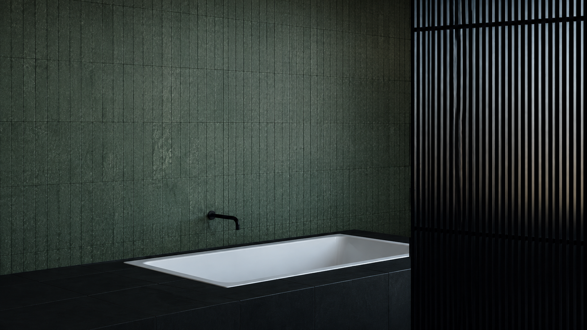 Ollivera marble installation in a dark green tiled bathroom