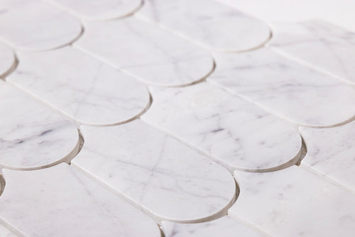Close-up of Aurialle Carrara marble scallop mosaic tile