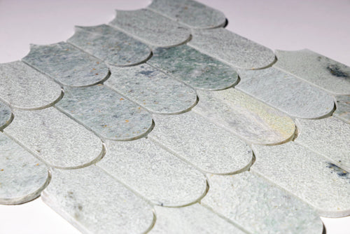 Close-up of Borealle green marble scallop mosaic tile