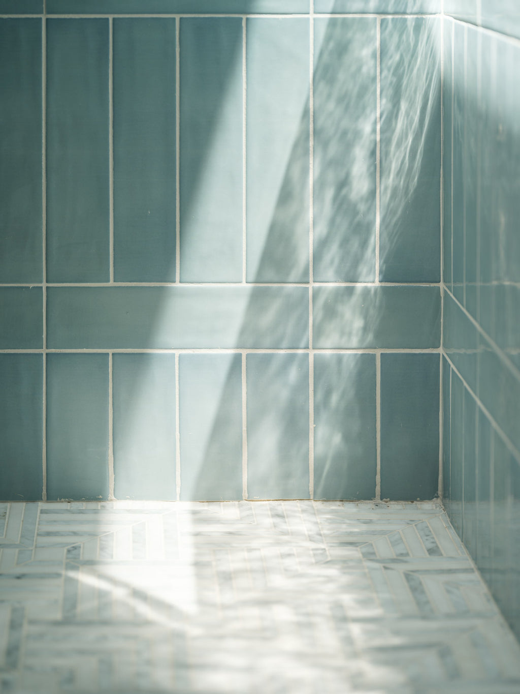 Aerial ceramic tile and Parallax Olympus marble mosaic installation detail