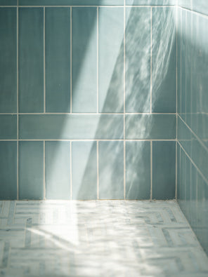 Aerial ceramic tile and Parallax Olympus marble mosaic installation detail