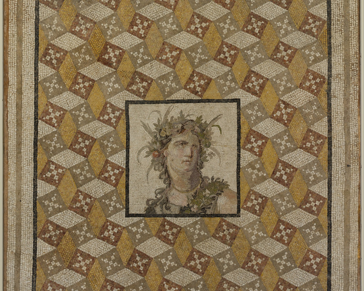 Roman mosaic floor panel with a central female bust surrounded by geometric stone, tile, and glass tesserae.