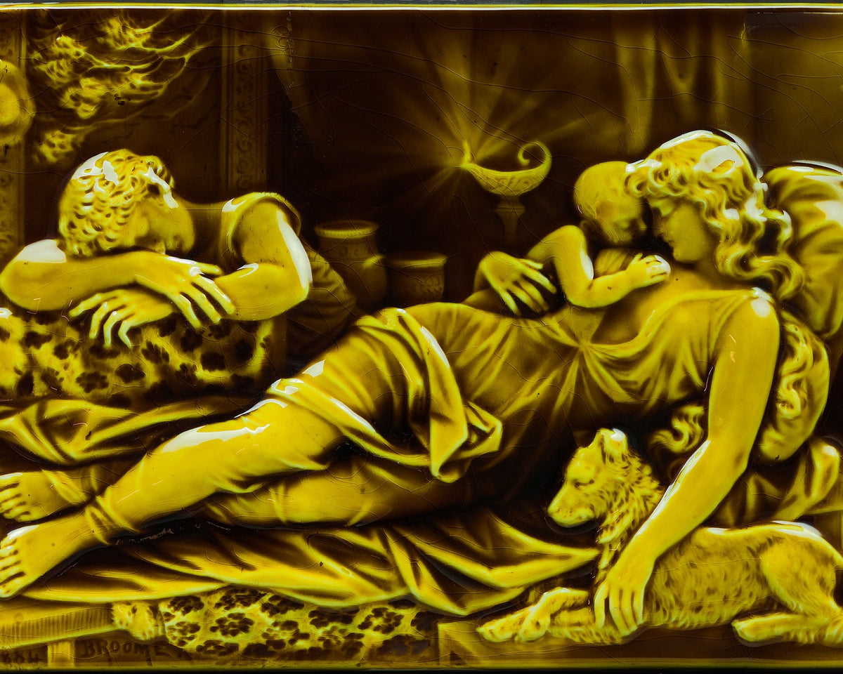 Amber-glazed relief tile showing reclining classical figures, designed by Isaac Broome and made by Trenton Tile Works.