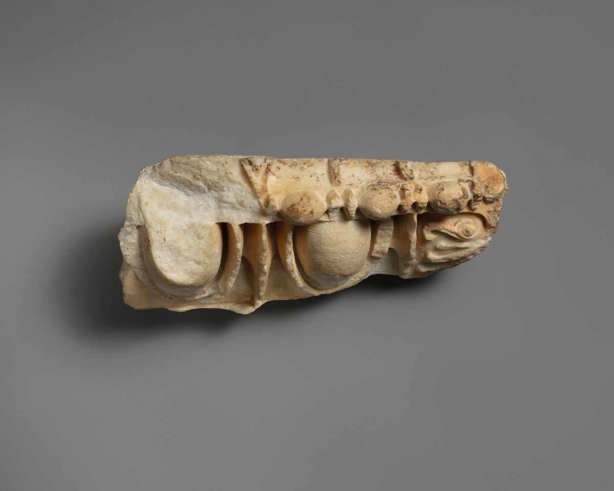 Ancient Greek marble architectural fragment with egg-and-dart, bead-and-reel and palmette carving.