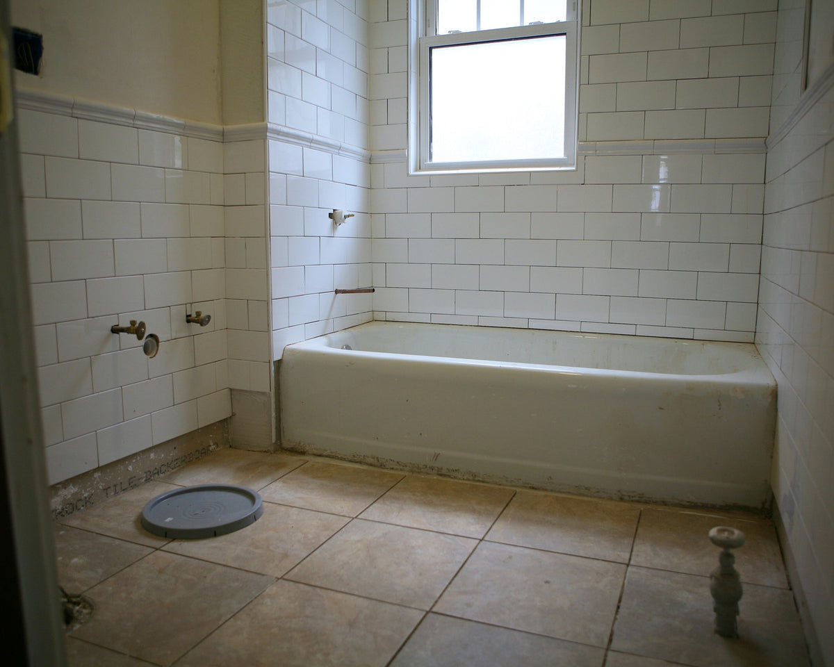 White glazed subway tile in a bathroom finished with a rounded bullnose edge.