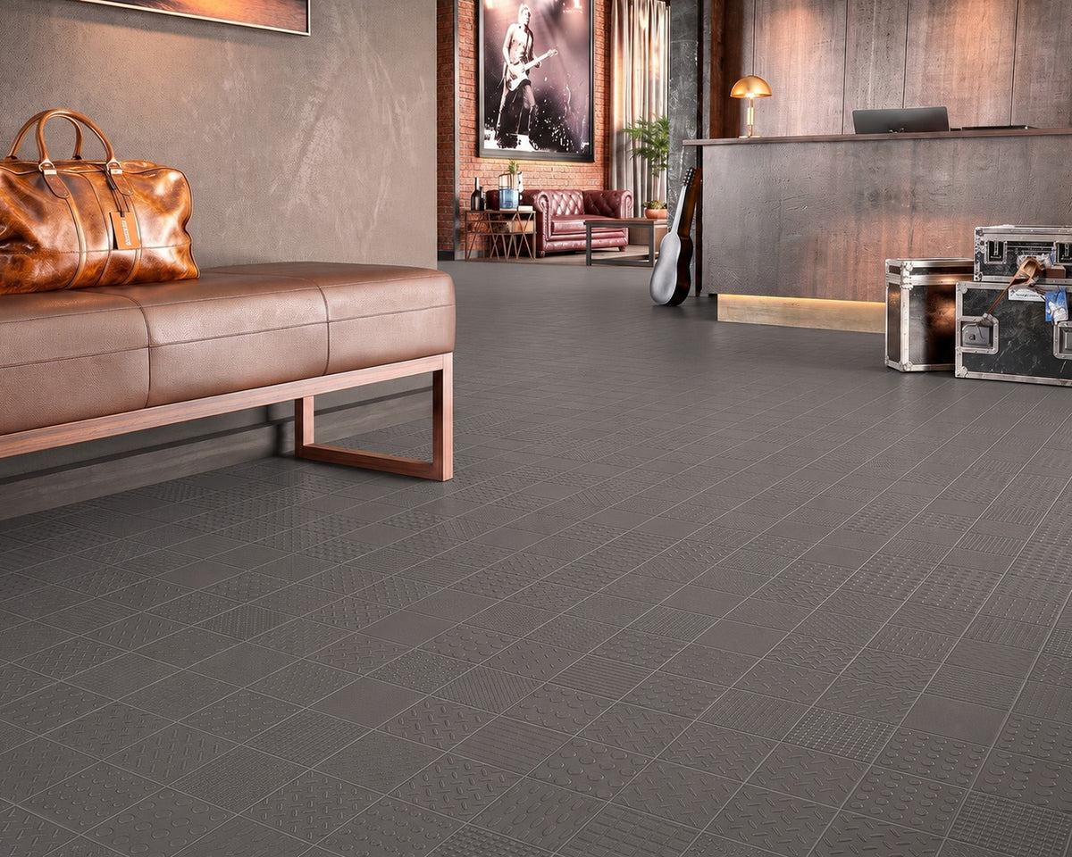 Small Appiani Lamiere relief tiles repeated across an architectural surface in a pastel finish.