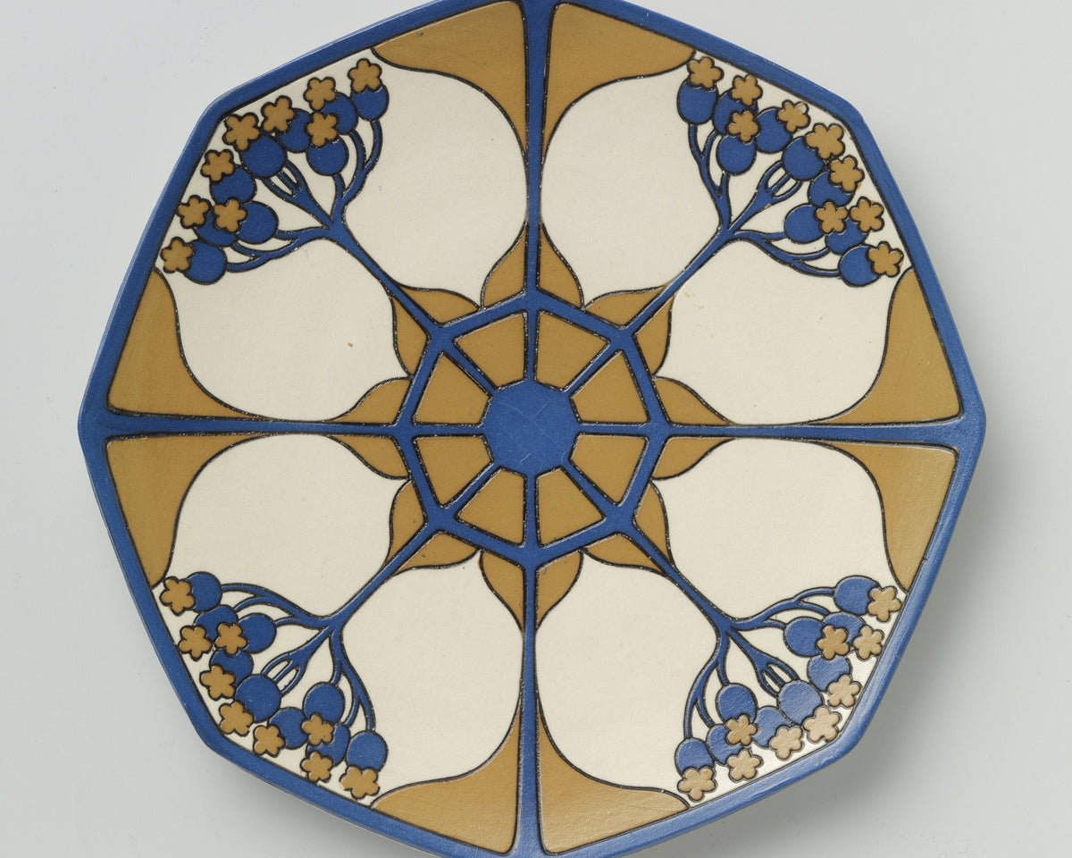 Blue and ochre Mettlach stoneware plate with radial ornament