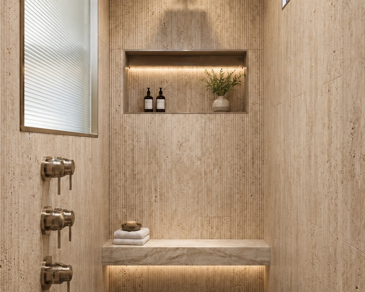 Corale travertine wall tile in a spa shower interior