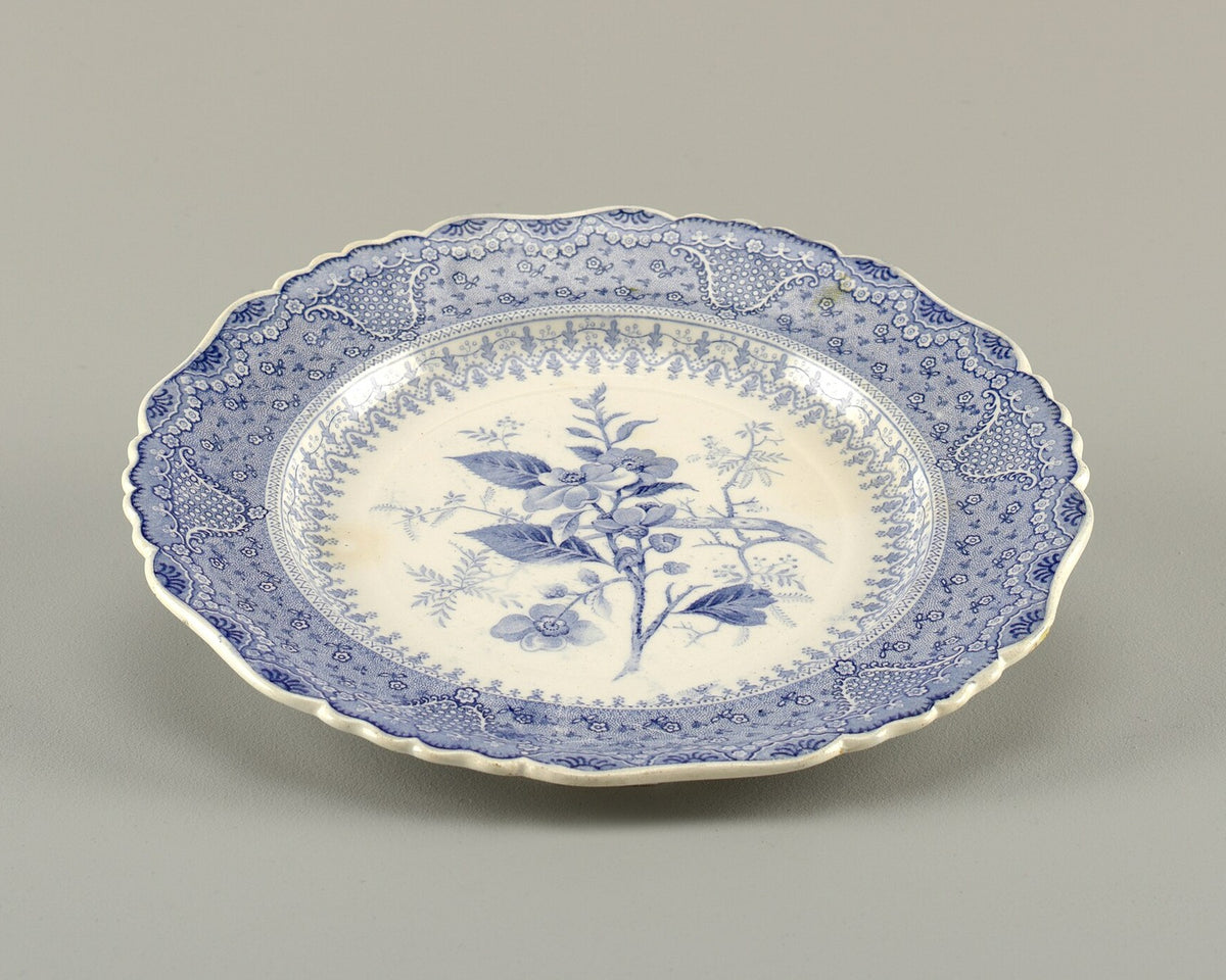 Blue transferware plate with an Asiatic Plants pattern