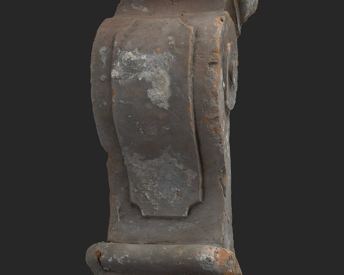 Terracotta console fragment with rectangles and scrolls