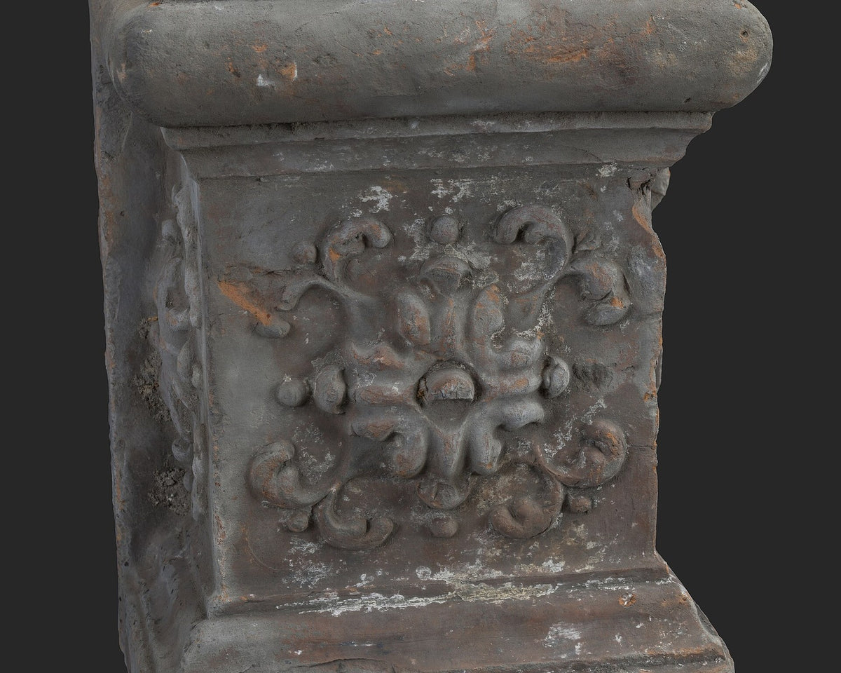 Terracotta base with molding and floral motifs