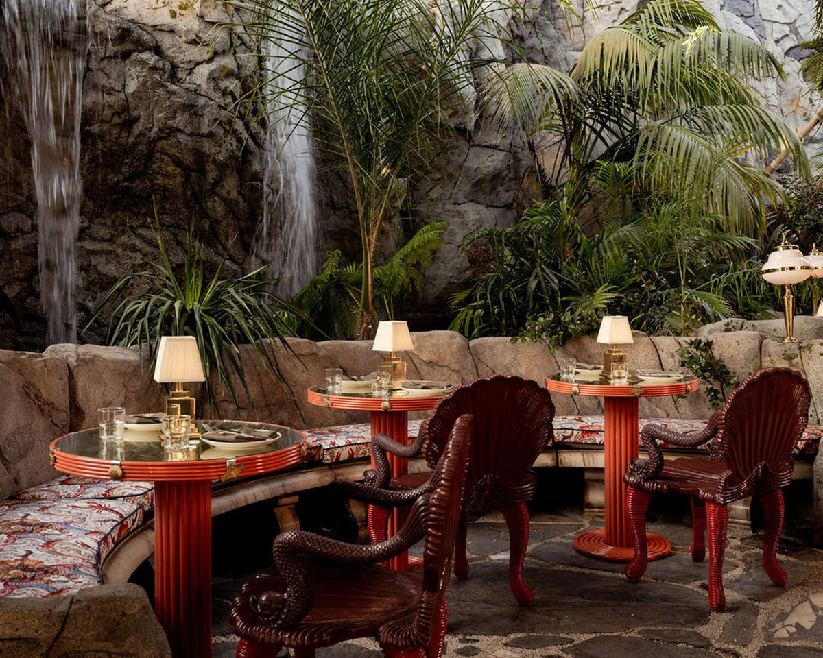 Night Hawk dining among rock walls and tropical planting at The Baby Grand
