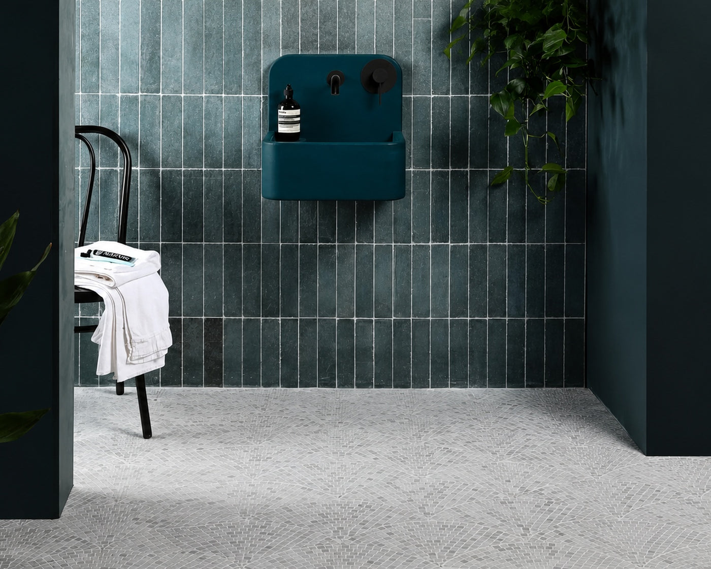 HAUS Pallazzo marble mosaic installed in a moody green bathroom