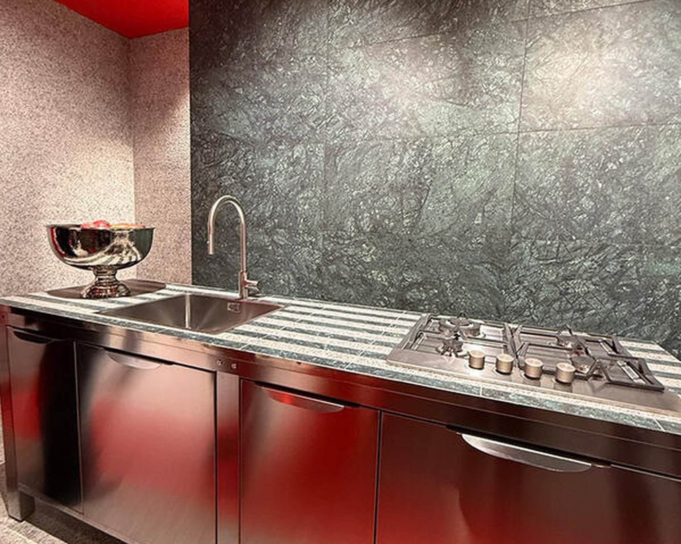 Large ceramic slabs used as kitchen wall and work surfaces at Cersaie 2025