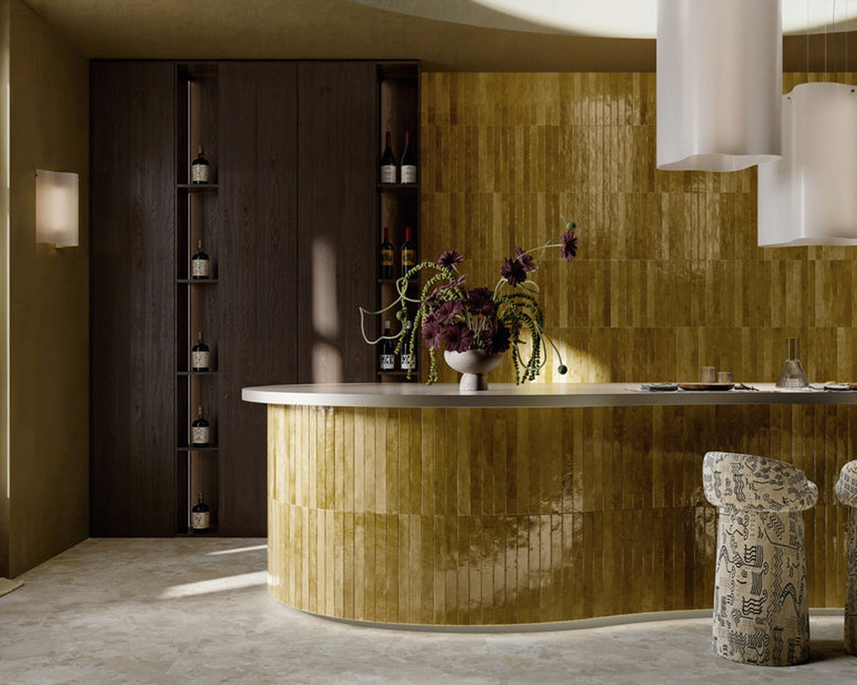 Pastorelli Colour Up Senf tile wrapping a mustard-toned bar