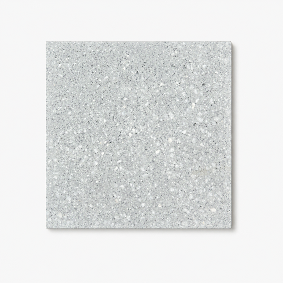 Tinman Ellie Gray 8 by 8 terrazzo tile on a white studio background