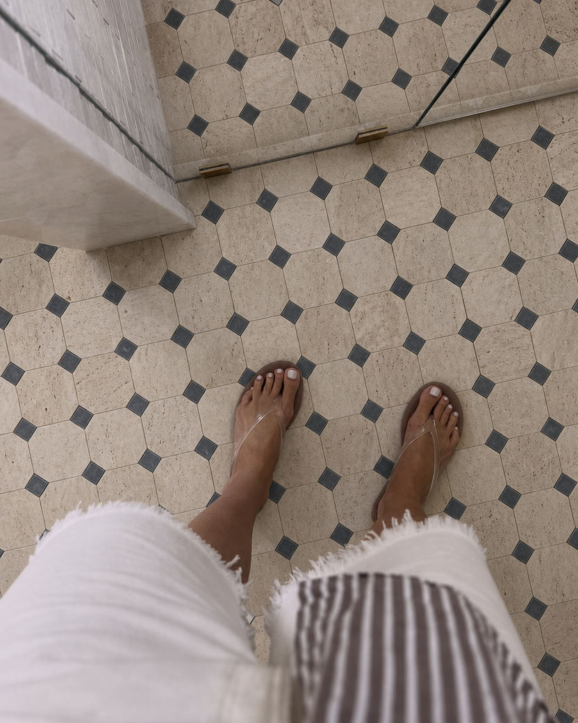 Close-up of Sirocco marble and travertine mosaic floor installation